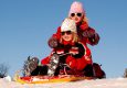 Otroci na snegu na smučišču Rogla
